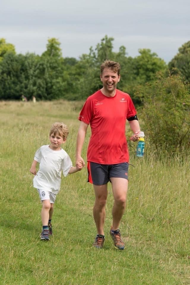 Wes Ball runs with his son William at a weekly Parkrun event in Buckinghamshire (Wes Ball/PA)