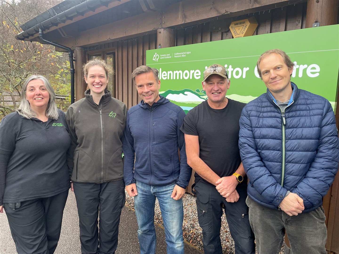 Duncan Swarbrick (centre) and Mike Gale (second right) at an open day for the new community owned Glenmore Visitor Centre earlier this year.