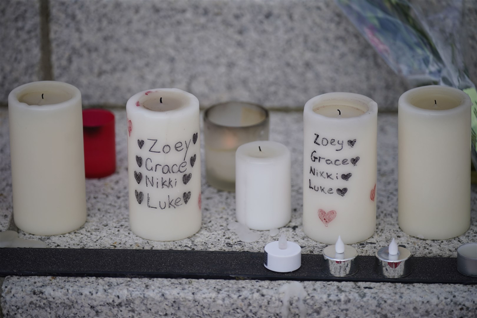 Candles among the tributes left at Kickham Plaza (Niall Carson/PA)