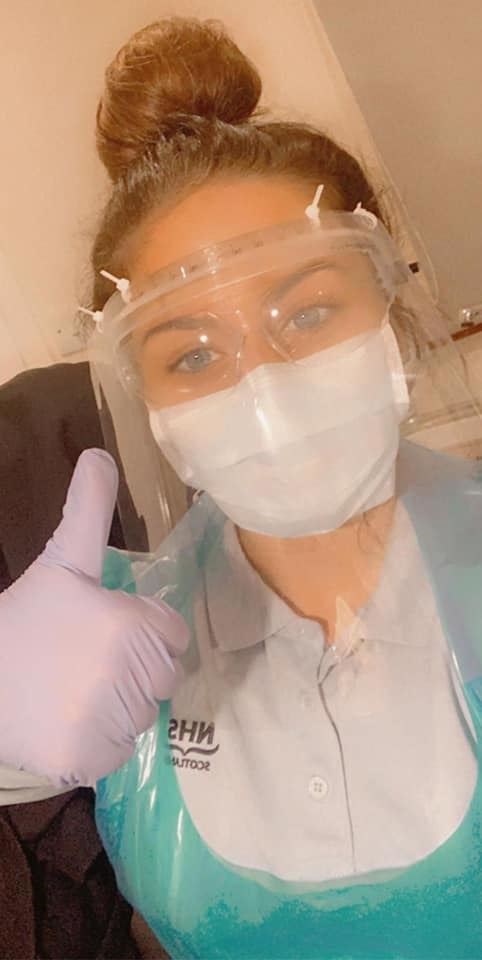 An NHS worker using one of the visors made by the school trio last week.