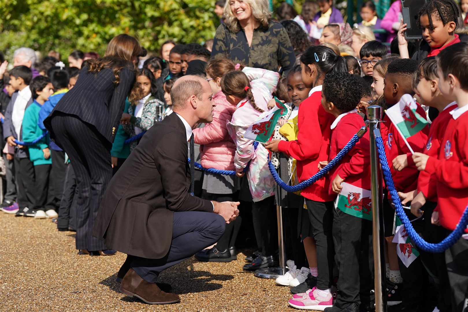 The Prince and Princess of Wales meet schoolchildren during a visit to the Grange Pavilion in Cardiff (Jacob King/PA)