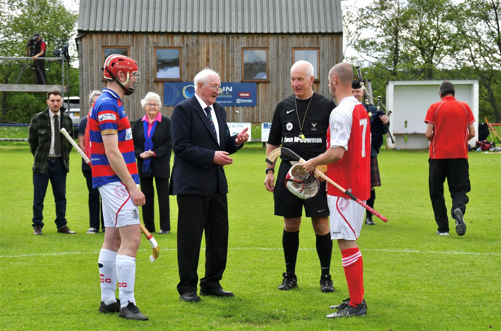 CENTRE OF ATTENTION: Ian Ross performs the toss up with Kings captain Calum Grant and his Bute counterpart Ryan Craig, along with referee Willie MacDonald.