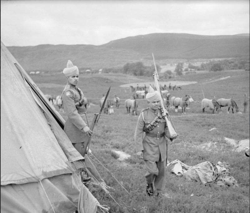 Members of Force K6 at one of their camps set up in the strath during World War II.