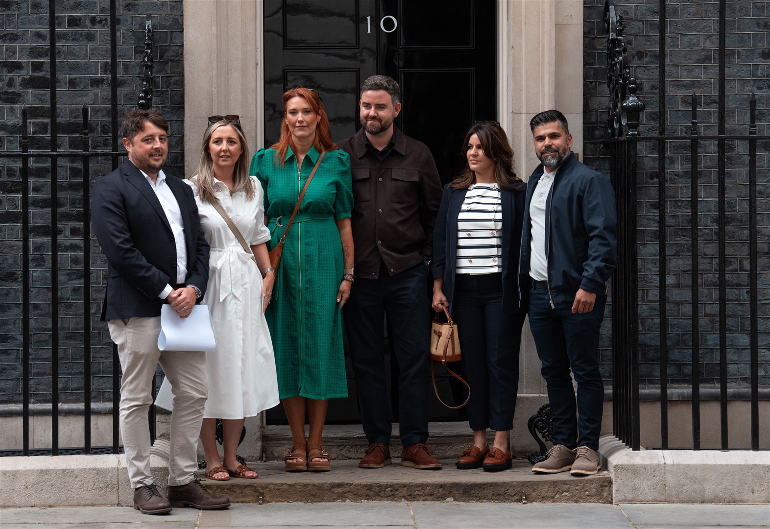 Families of the victims of the Southport attack (l to r) Chris Long and Jenni Stancombe, uncle and mother of Elsie Dot Stancombe, Lauren and Ben King, parents of Bebe King, and Alexandra Aguiar and Sergio Aguiar, parents of Alice Aguiar outside 10 Downing Street (Carl Court/PA)