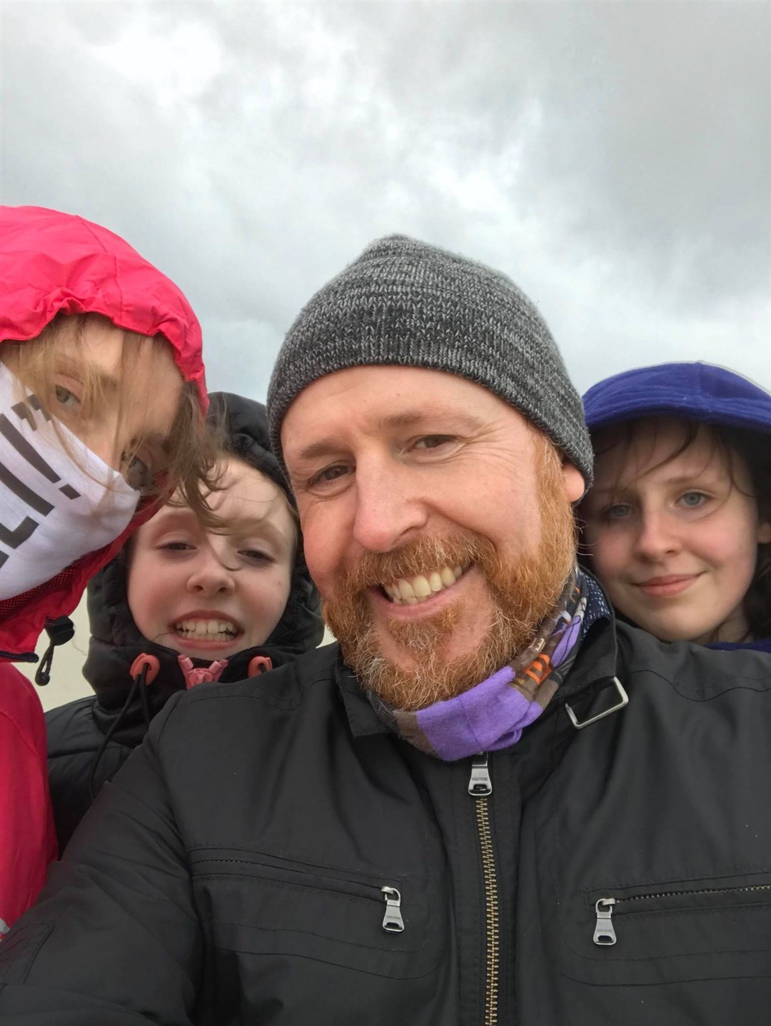 Neil Bremner with his wife and two daughters.