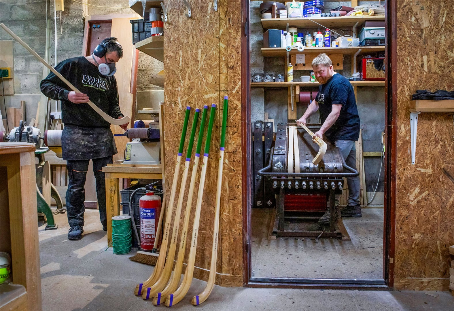 Alan MacPherson and apprentice Iain Fraser hard at work making camans.