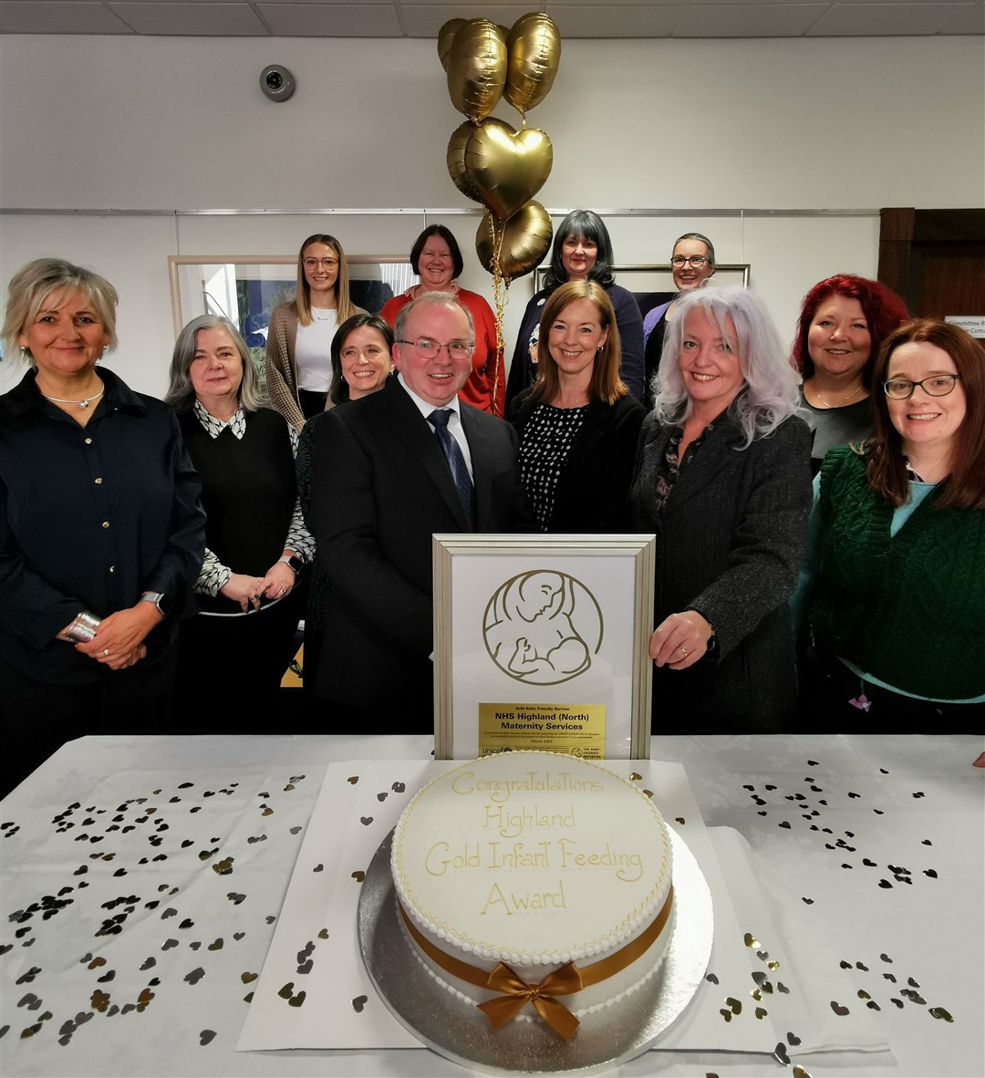 Cllr David Fraser, chairman of the health, social care and wellbeing committee, celebrates the Unicef Baby Friendly Initiative Gold accreditation with representatives of Highland Council and NHS Highland.