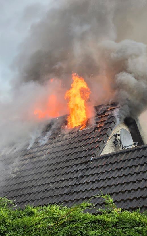 Flames leaping from the roof of the home. Picture: Lukas Dembicki.