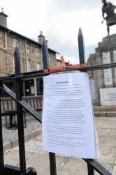 A note at Dingwall's war memorial urging people to lay flowers for Drummer Rigby as a sign of solidarity against terrorism