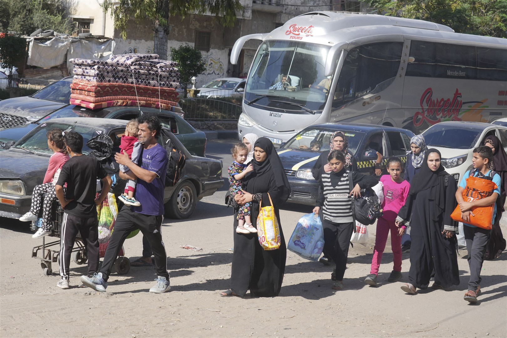 Palestinians flee to the southern Gaza Strip after the Israeli army issued an evacuation warning to 1.1 million people (Hatem Moussa/AP)