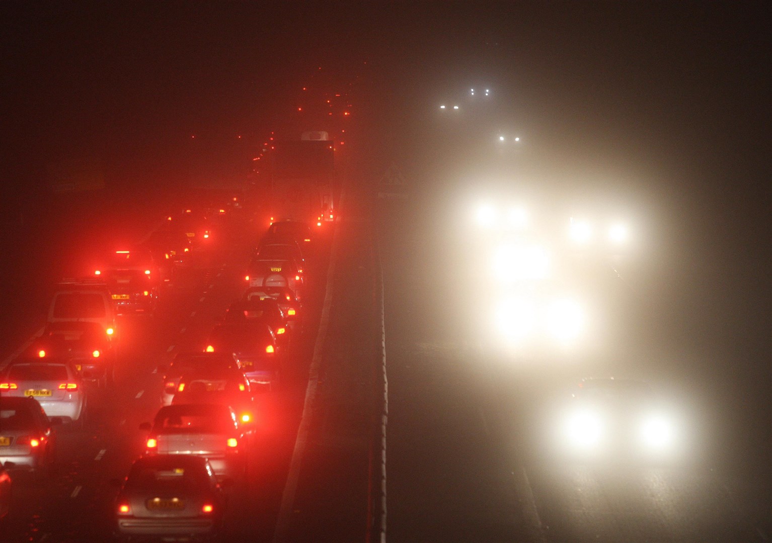 Traffic in the fog (Andrew Milligan/PA)