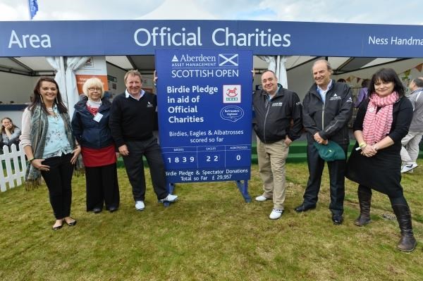 First Minister Alex Salmond at the Scottish Open wih representatives of the charities and Aberdeen Asset Management executives