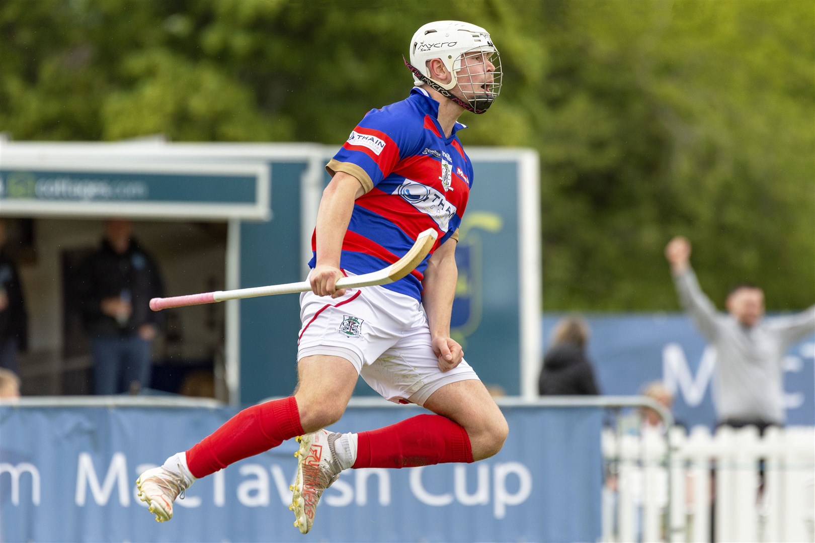 Kingussie marksman Roddy Young flying high after putting his team into the lead late in the second half. The cottages.com MacTavish Cup Final - Caberfeidh v Kingussie, played at The Bught, Inverness.