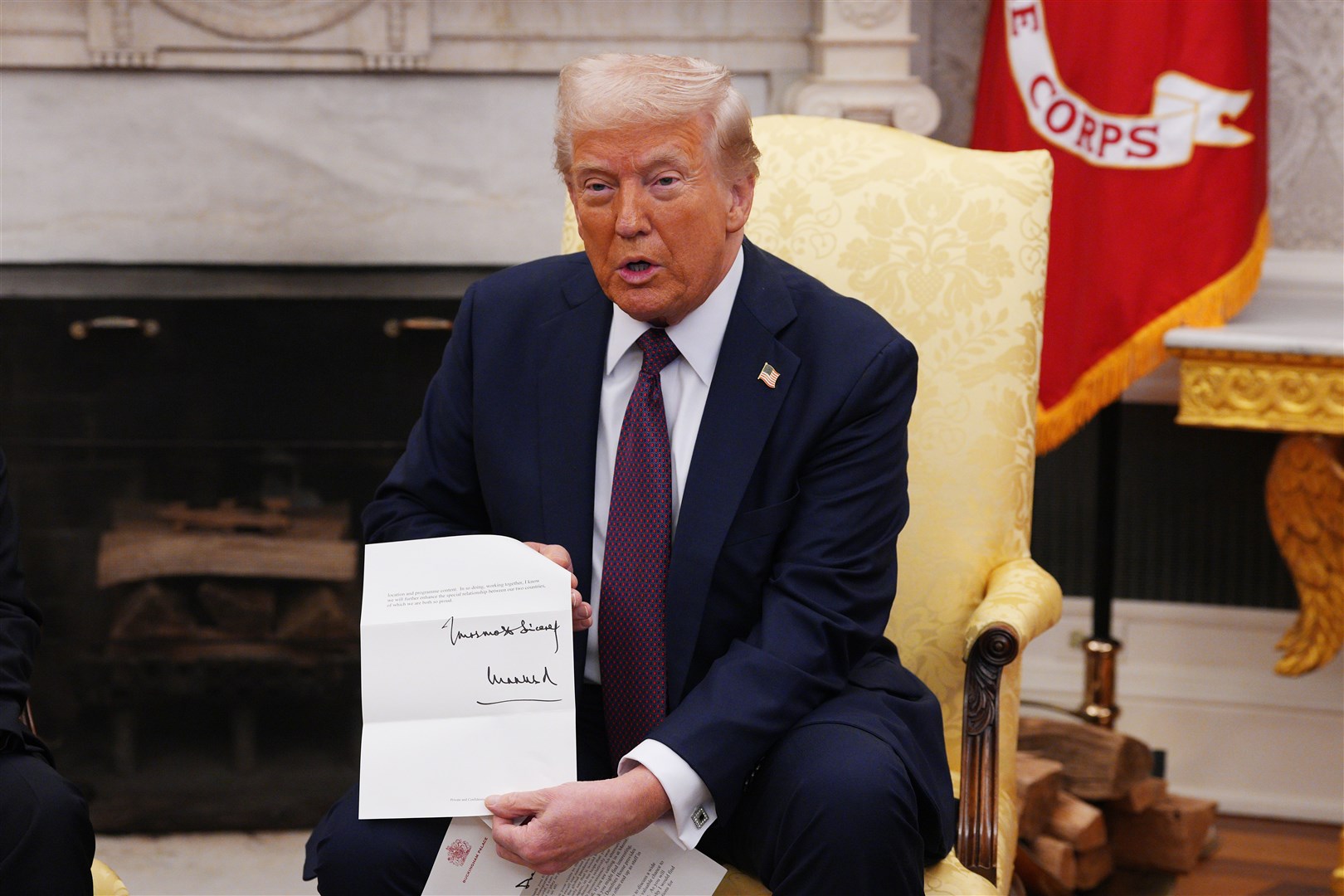 US President Donald Trump is presented with a letter from the King (Carl Court/PA)