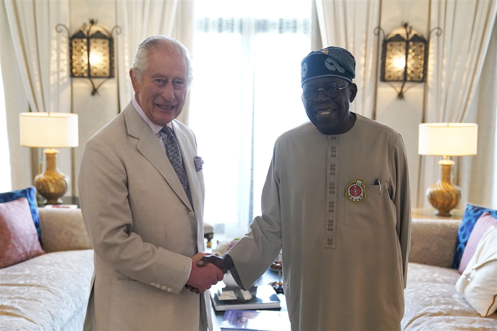 The King and Nigerian President Bola Ahmed Tinubu held a bilateral meeting at a hotel in Dubai ahead of the Cop28 summit (Andrew Matthews/PA)