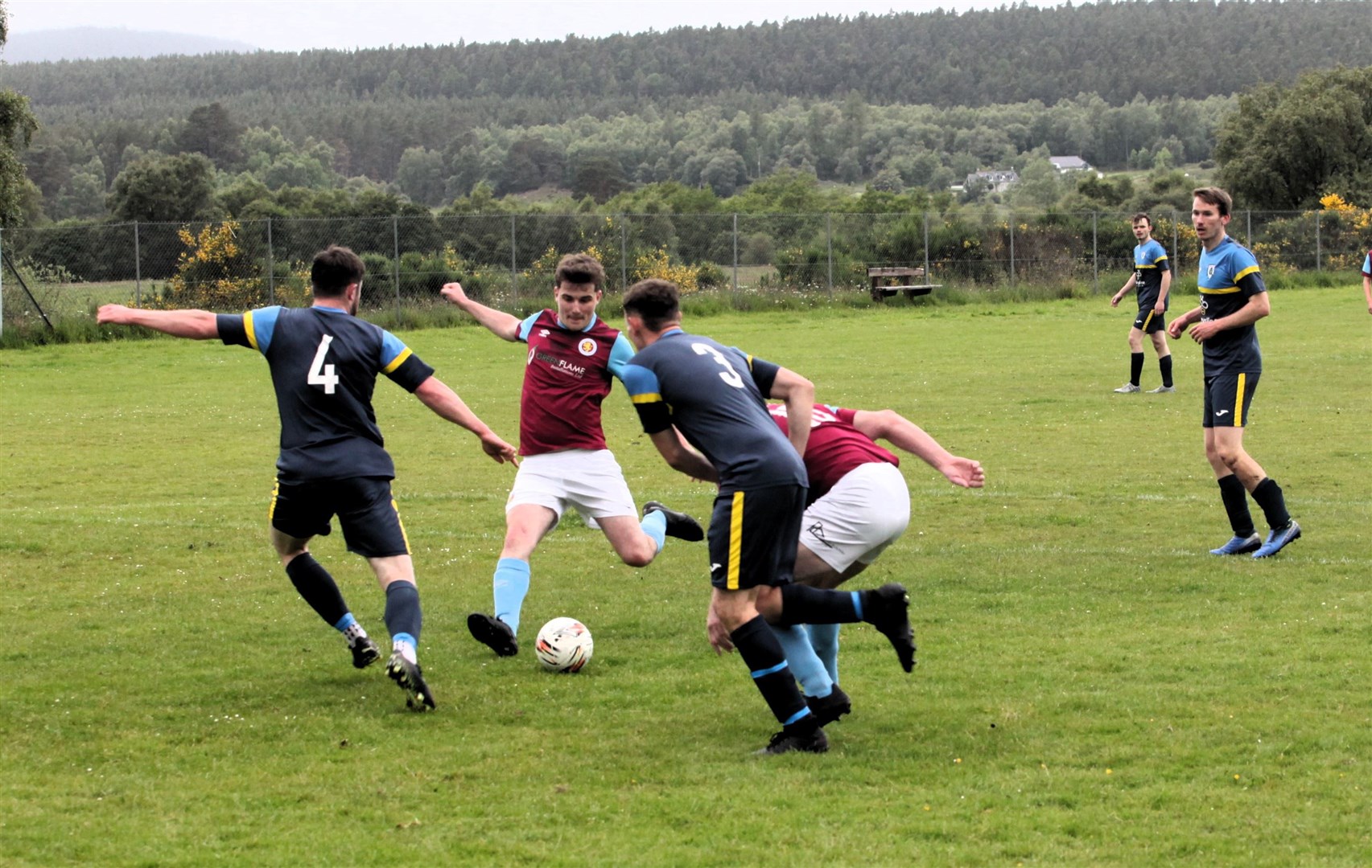 Grantown United's Fraser Greenlees tries to get a shot away against Cromdale.