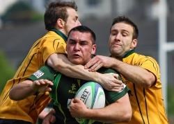 John Miller of the Greens tries to burst through the select defence. www.jamesgunn.co.uk