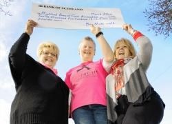 Bra Nicht committee member Maggie Roger (centre) handing over £12,500 to Highland Breast Care Association's Hilda Nicholl and Jan Smyth.