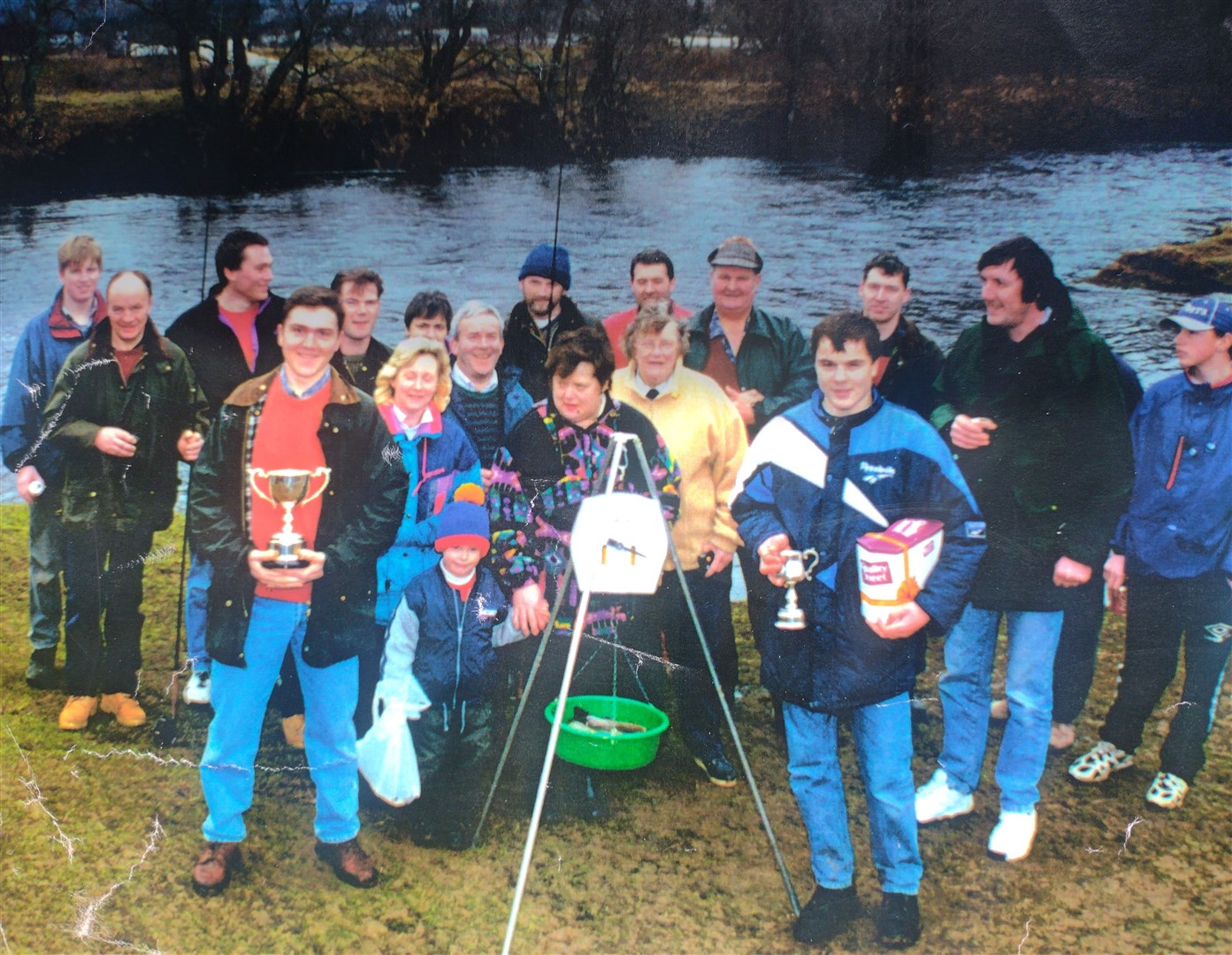 HEY-DAY: Marion Ramage (in yellow) at the centre of things as usual during a weigh-in with fellow local anglers back in the 1990s.