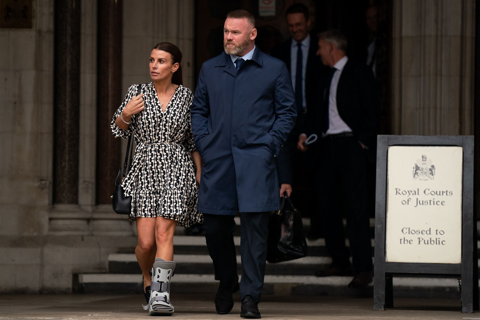 Coleen and Wayne Rooney leave the Royal Courts Of Justice in London (Aaron Chown/PA)