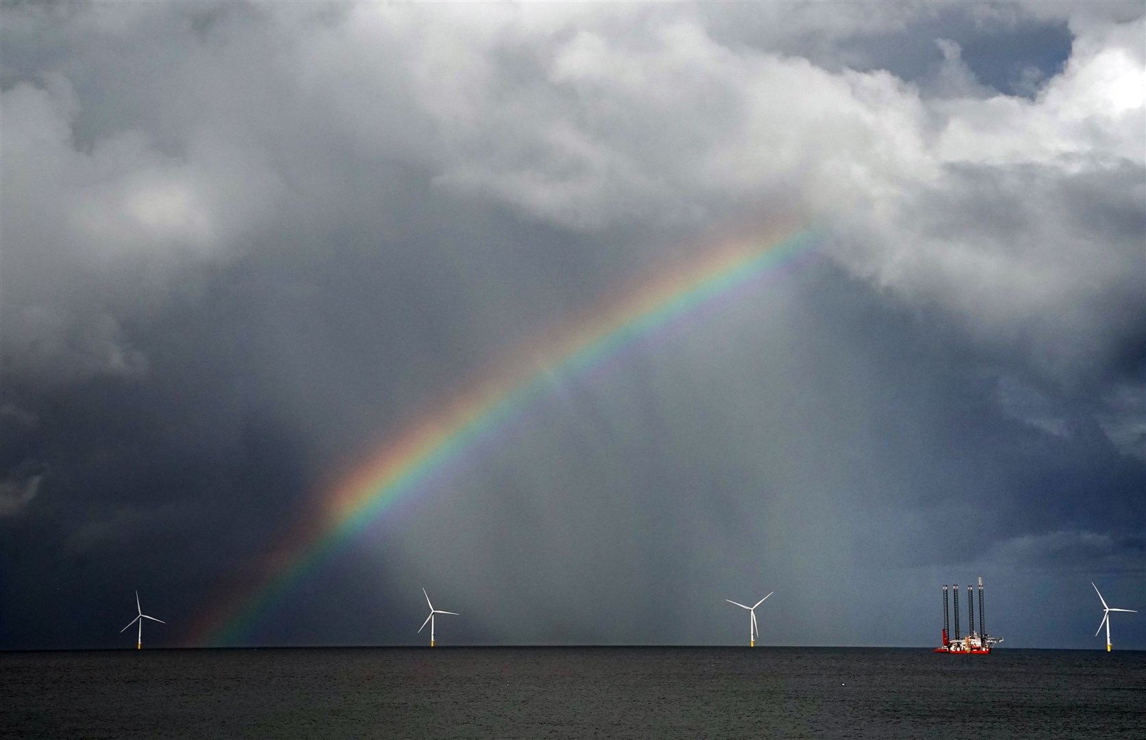 A rainbow over Blyth Offshore Wind Farm (Owen Humphreys/PA)