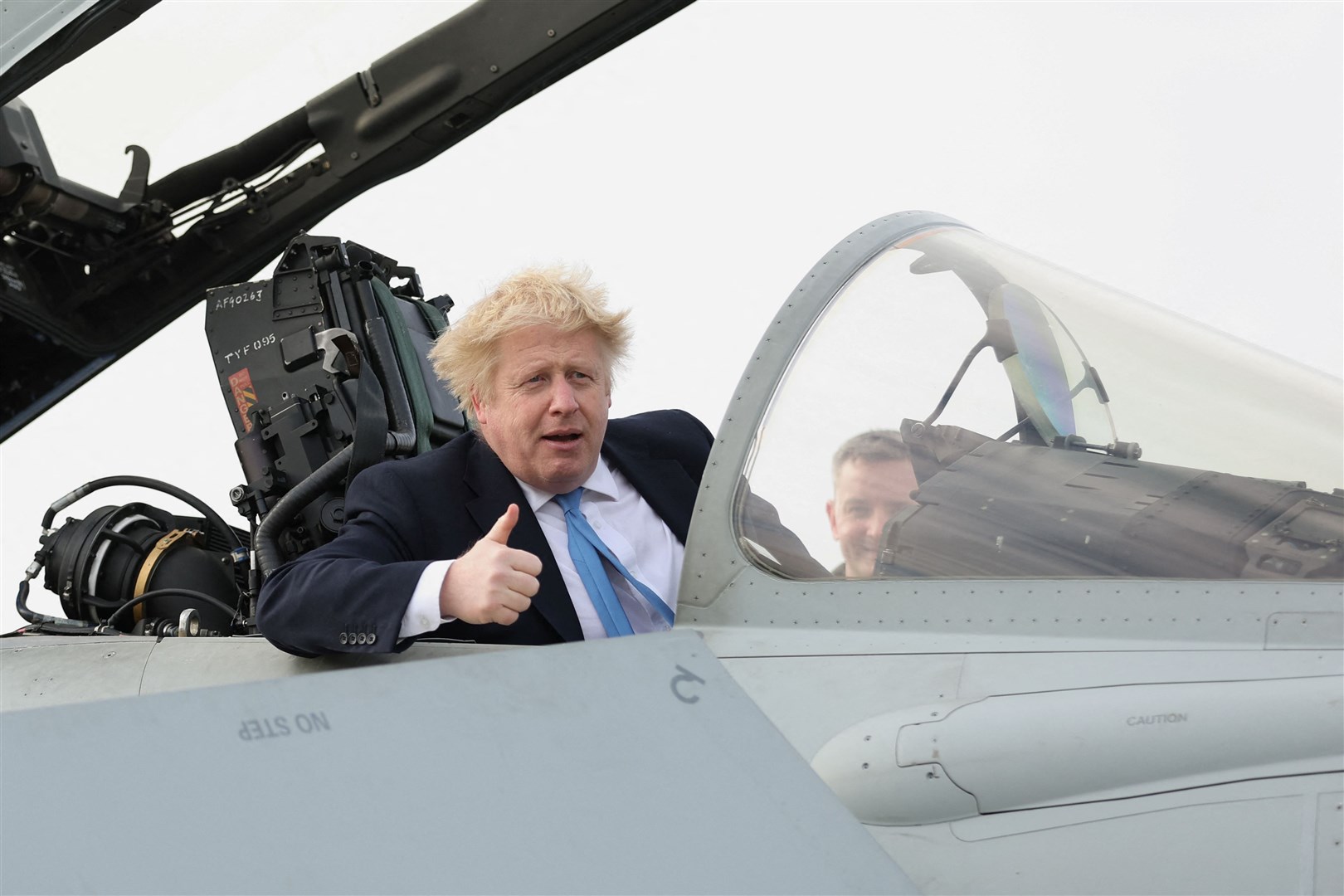 Prime Minister Boris Johnson sits in the cockpit of a fighter plane (Carl Recine/PA)