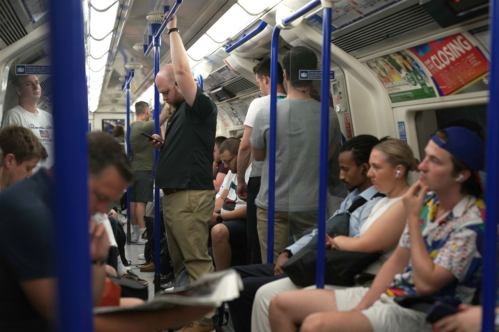 People on a Northern Line train in London as temperatures reached 40C for the first time on record in the UK (Aaron Chown/PA)