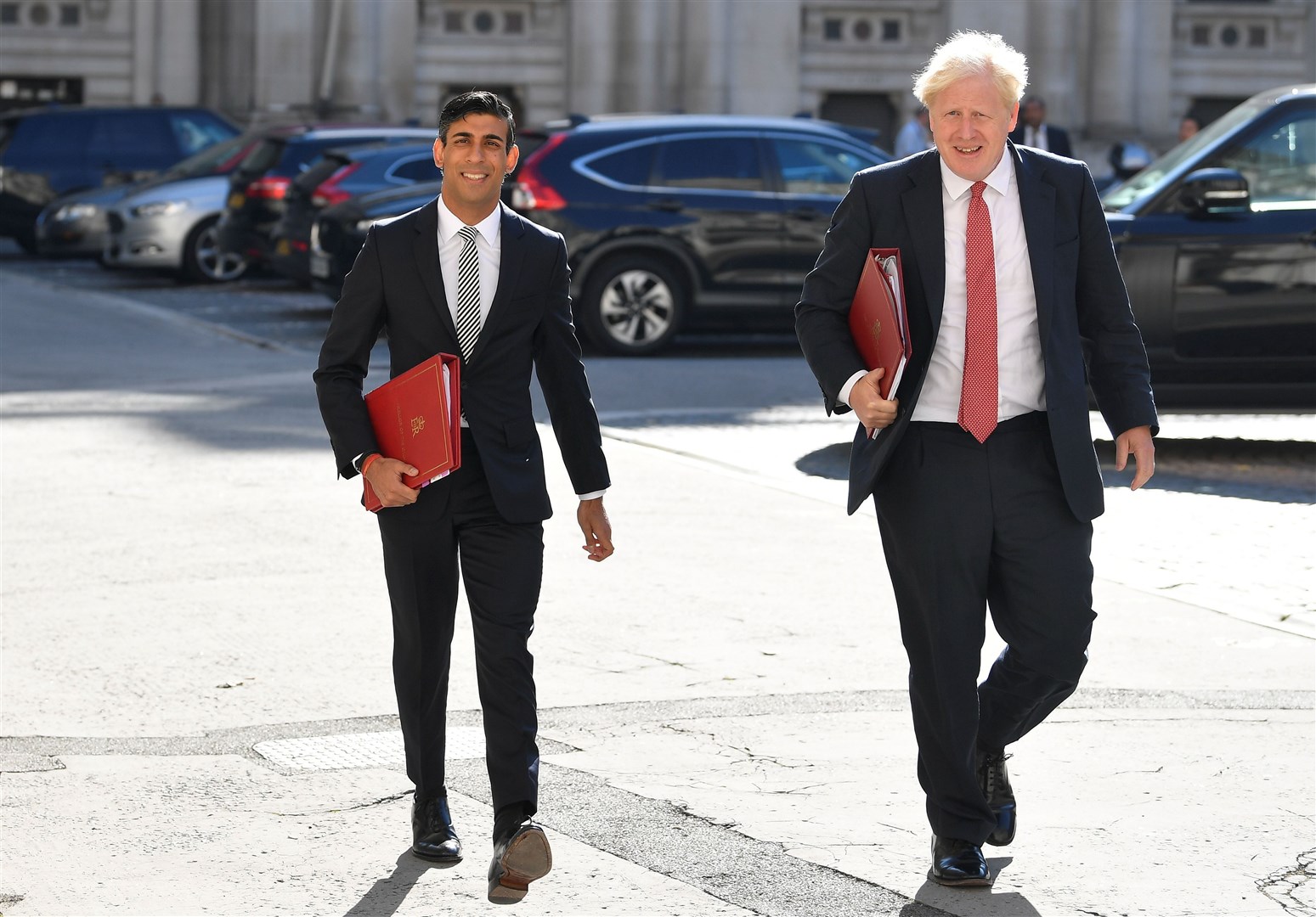 Boris Johnson and Rishi Sunak put on a united front as they made a firm commitment to go ahead with the controversial National Insurance hike (Toby Melville/PA)