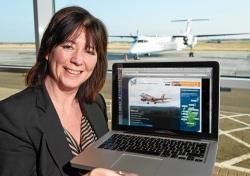 Anne McKinlay, airport duty manager, tries the new service at Inverness Airport