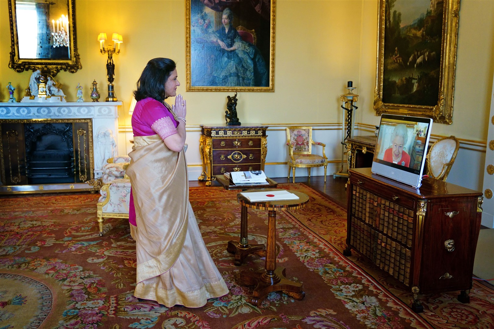 Although her public appearances were less frequent, the nonagenarian monarch kept up a busy schedule of virtual appearances. Here, she holds a virtual audience with the High Commissioner of India, Gaitri Issar Kumar, at Buckingham Palace (Victoria Jones/PA)