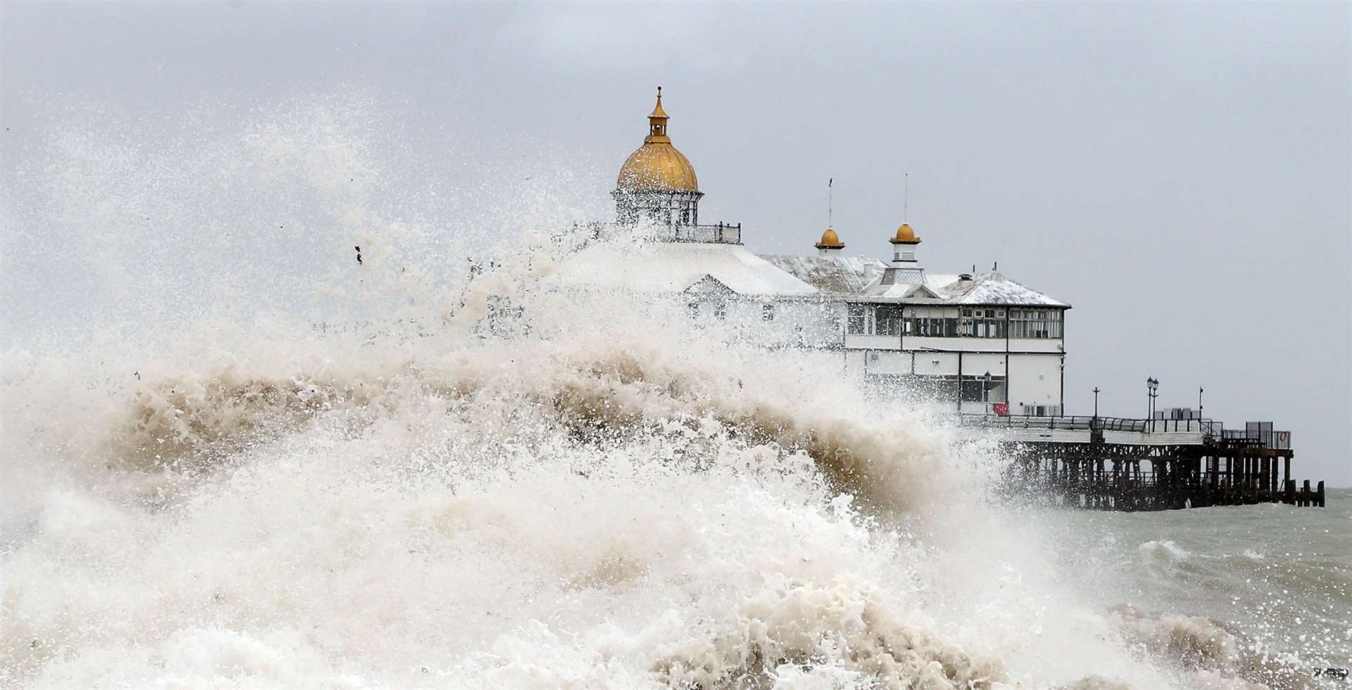 Waves crash near the pier in Eastbourne in August (Gareth Fuller/PA)