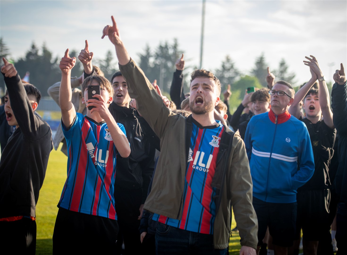 Fans protested on the pitch at full time. Picture: Callum Mackay