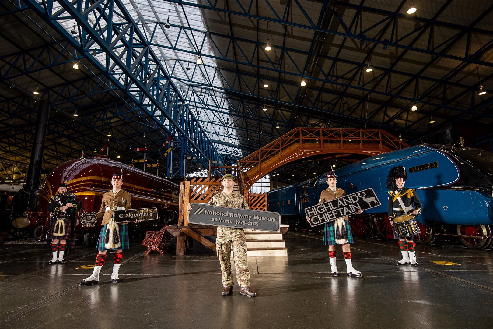 Soldiers of the Royal Regiment of Scotland (SCOTS), with the name plates, that are coming up for Charity Auction at the National Railway Museum