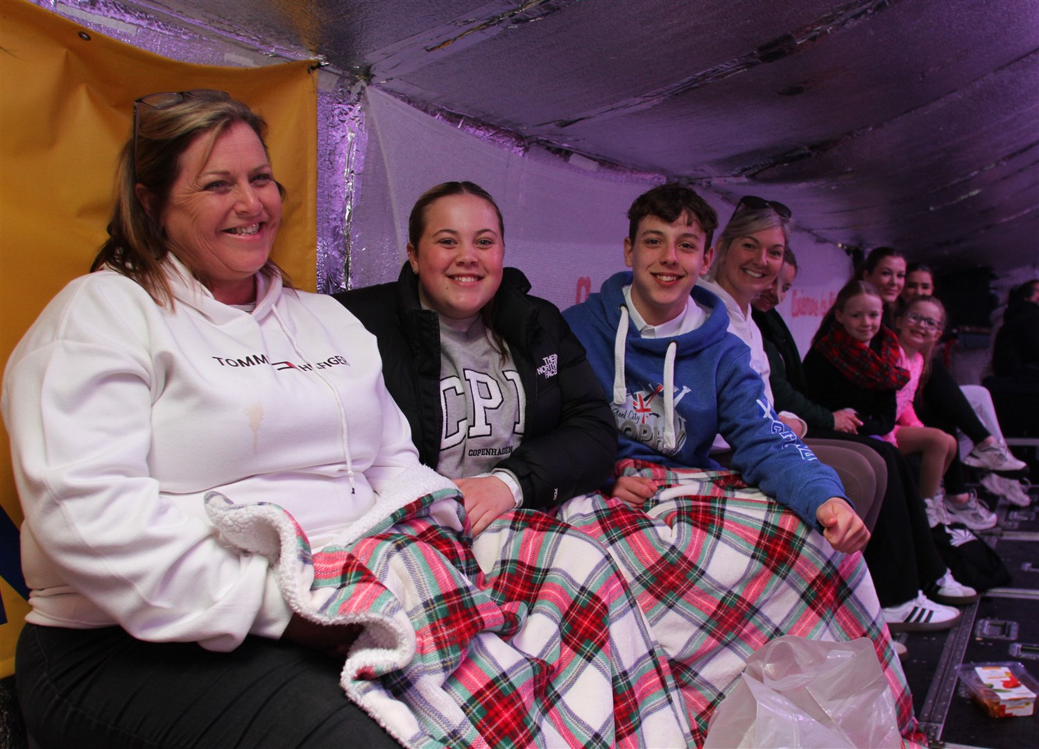 KEEPING WARM: Part of the audience who helped cheer the skaters on.