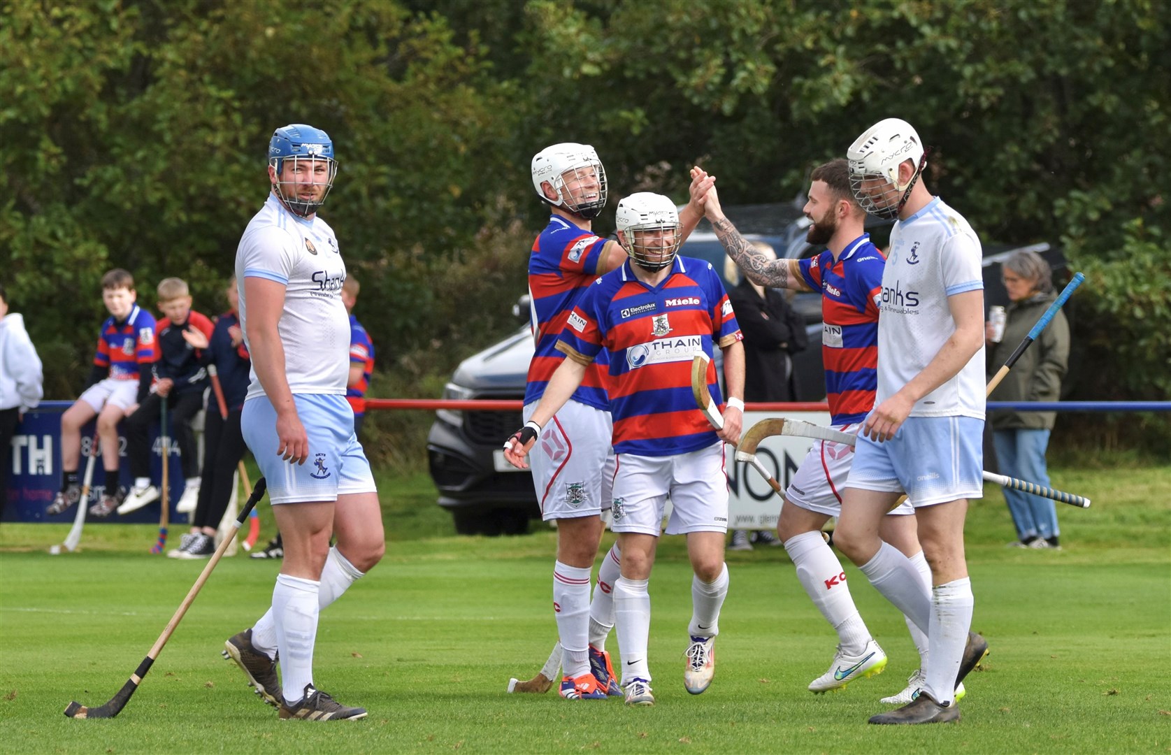 Roddy Young, stand-in skipper Thomas Borthwick and Ruaridh Anderson celebrate one of their side's 11 goals at the weekend. Picture: Fiona Young.