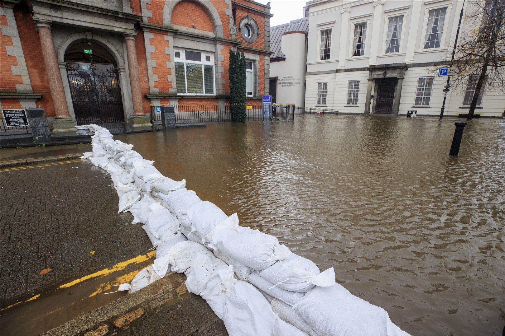 Sandbags hold back floodwater at Bank Parade in Newry on Tuesday (Liam McBurney/PA)