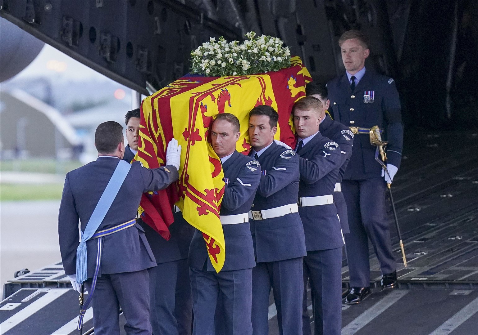 The bearer party from the Queen’s Colour Squadron carry the Queen’s coffin to the state hearse (Arthur Edwards/The Sun)