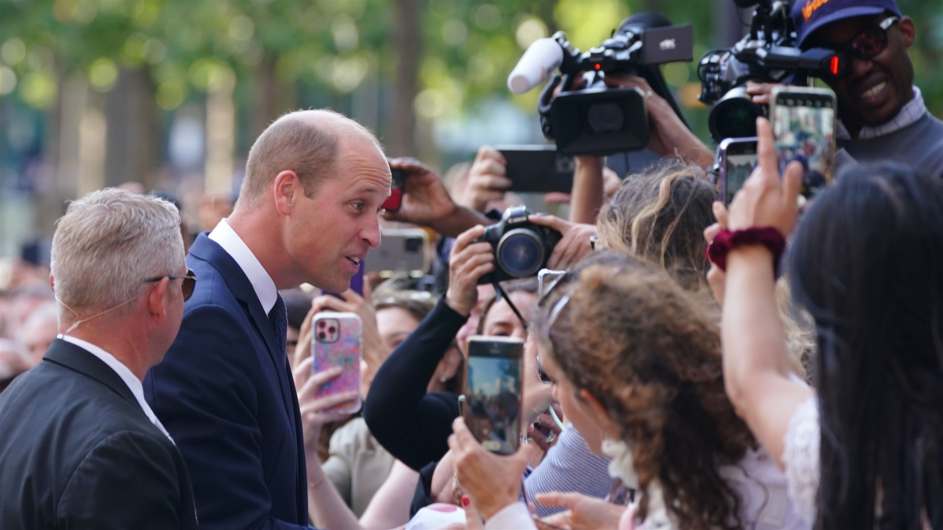 The Prince of Wales greets the crowds in New York (Peter Byrne/PA)