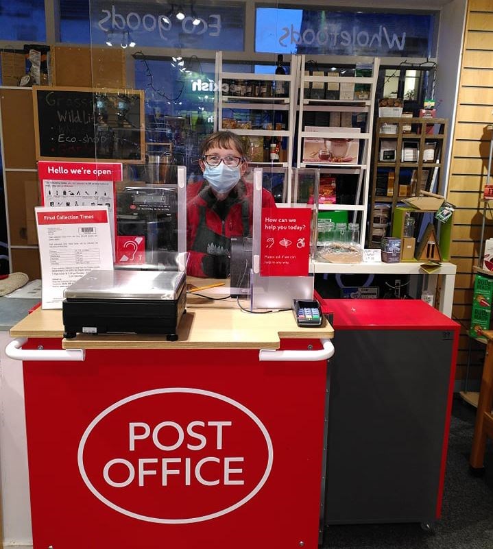 Grassroots owner Iona Malcolm behind the new Post Office counter in Kingussie.