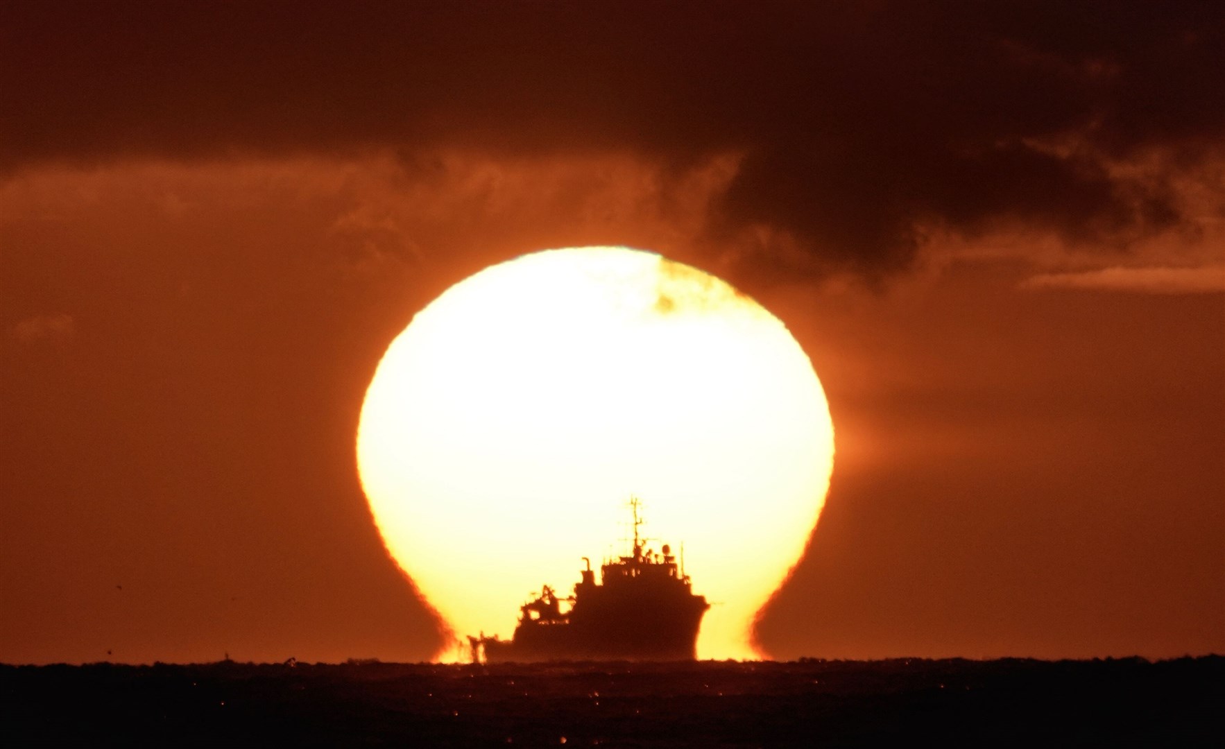 The Ocean Dee ship on the horizon in the North Sea off Whitley Bay (Owen Humphreys/PA)