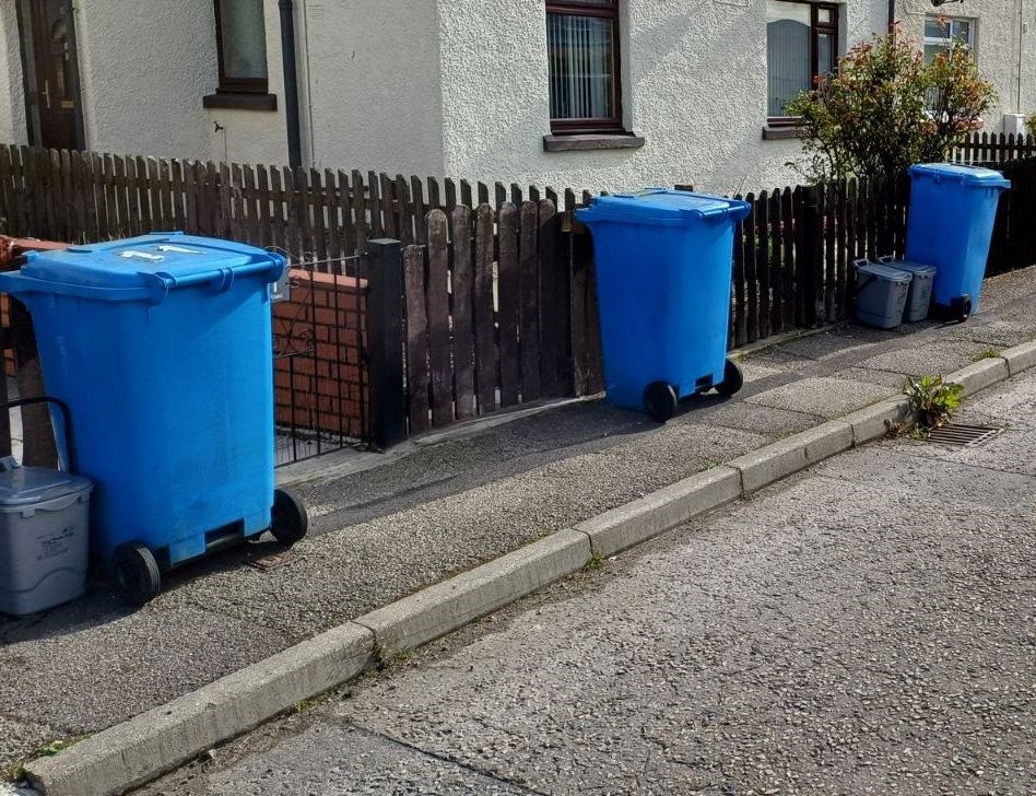 Paper, card and cardboard recycling bins and food waste caddies out in the region. Picture: Highland Council