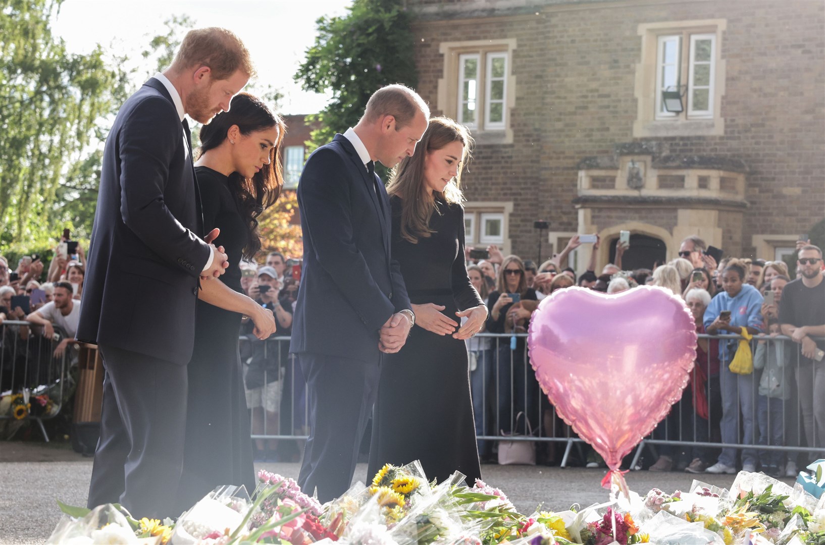 The Prince and Princess of Wales and the Duke and Duchess of Sussex viewing the messages and floral tributes (Chris Jackson/PA)