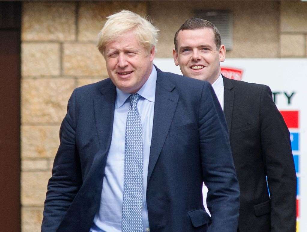 Prime Minister Boris Johnson in Fochabers with Scottish Conservative leader Douglas Ross who voted against him.