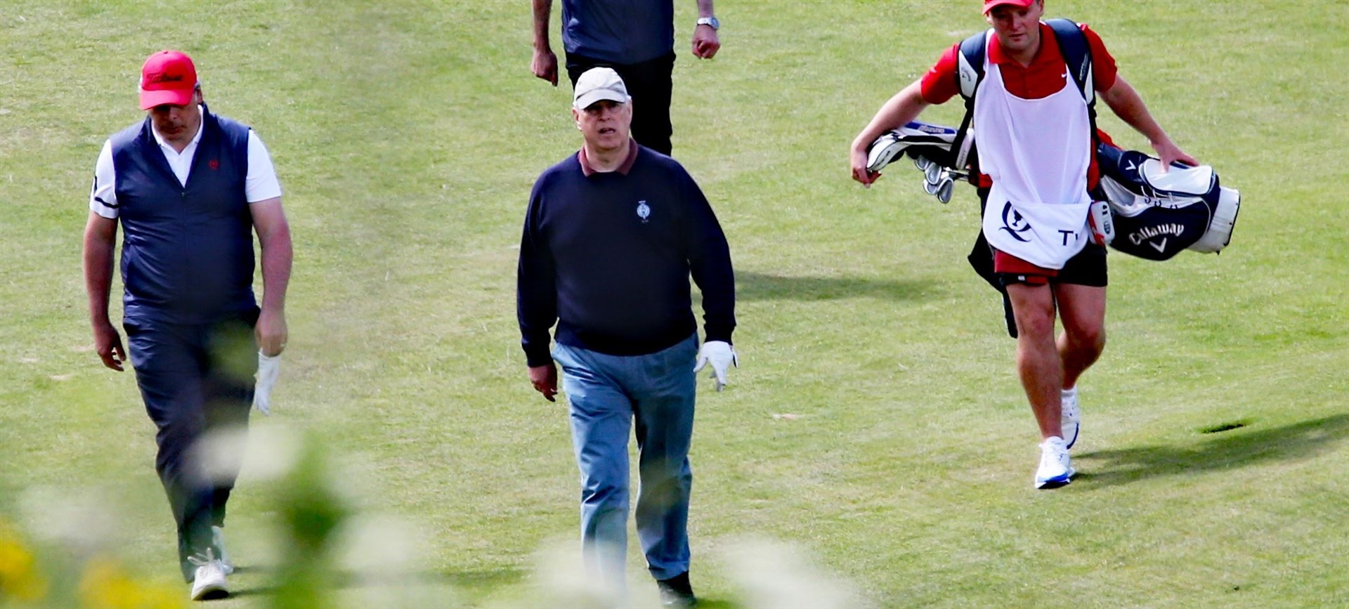 Prince Andrew and members of his golfing party.