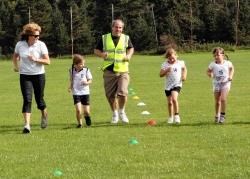 Officials with kids in the new junior tri