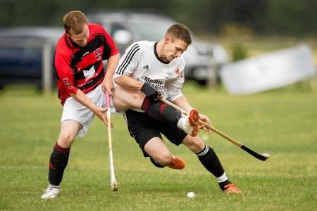 Glenurquhart's Daniel Mackintosh goes up against Lovat skipper Daniel Grieve. Picture: Neil Paterson.