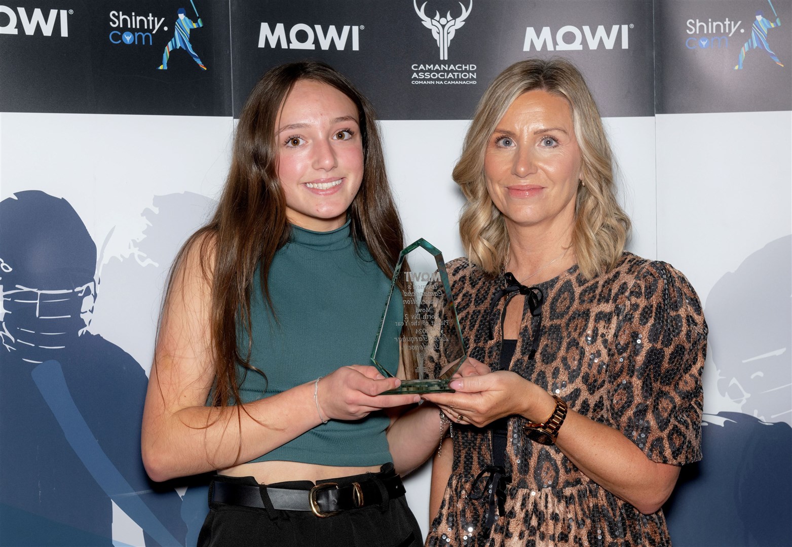 WCA North Division 2 Player of the Year, Lexi Farquhar of Badenoch, being presented with her trophy by Jayne Mackay of Mowi.