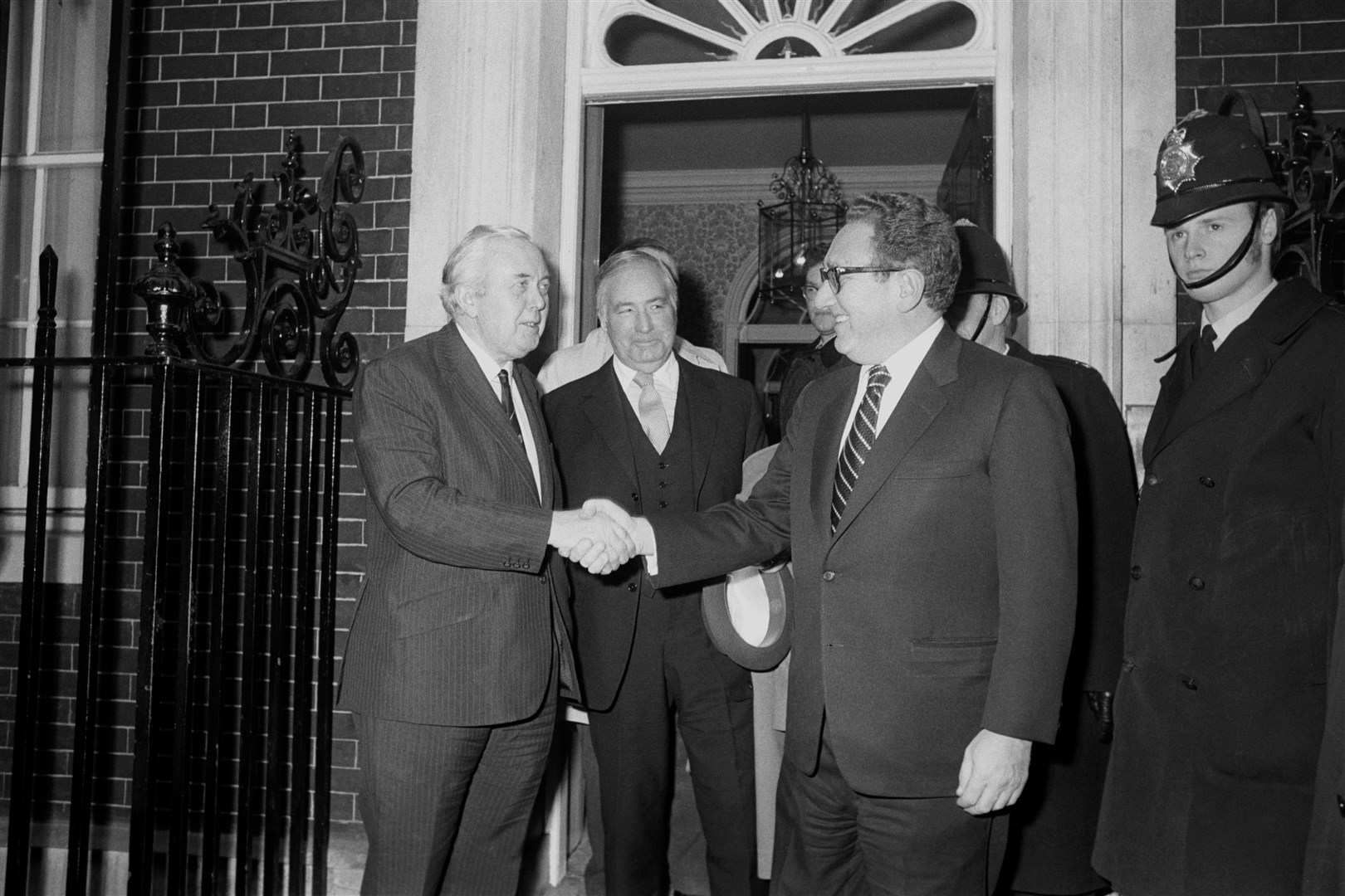 Former prime minister Harold Wilson with Mr Kissinger in March 1974 (PA)