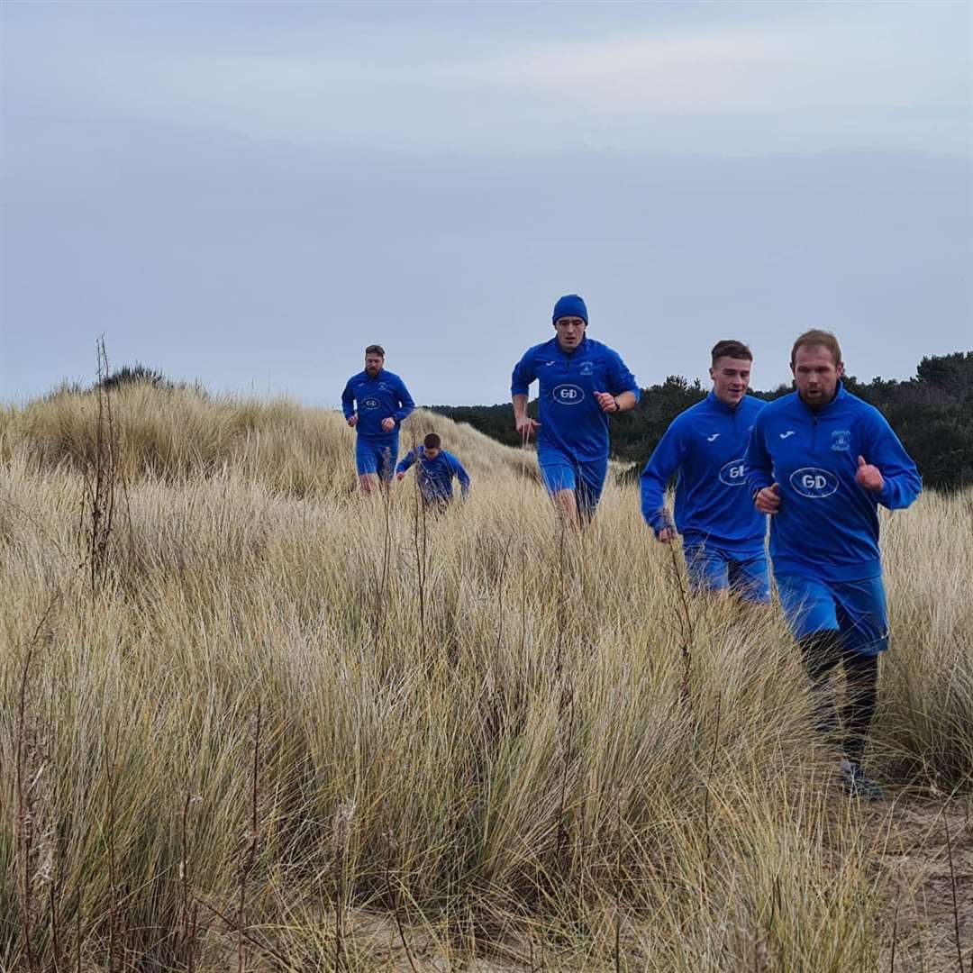 Keeper Robbie Donaldson and team-mates training on the sand dunes at Nairn.