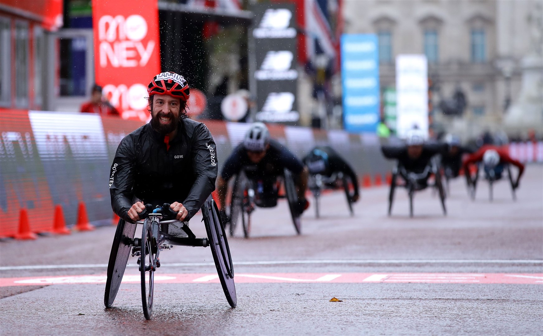 Canada’s Brent Lakatos wins the wheelchair race (Richard Heathcoate/PA)